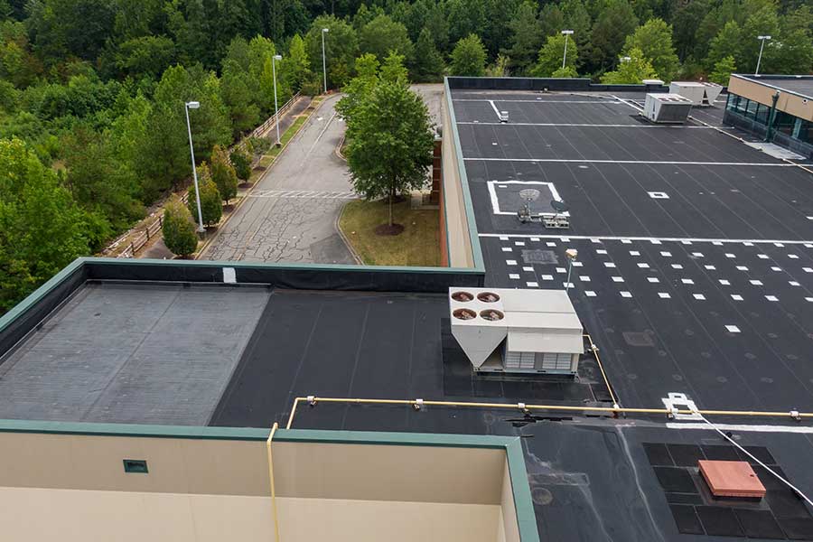 Large building rooftop with HVAC unit used for commercial repair service